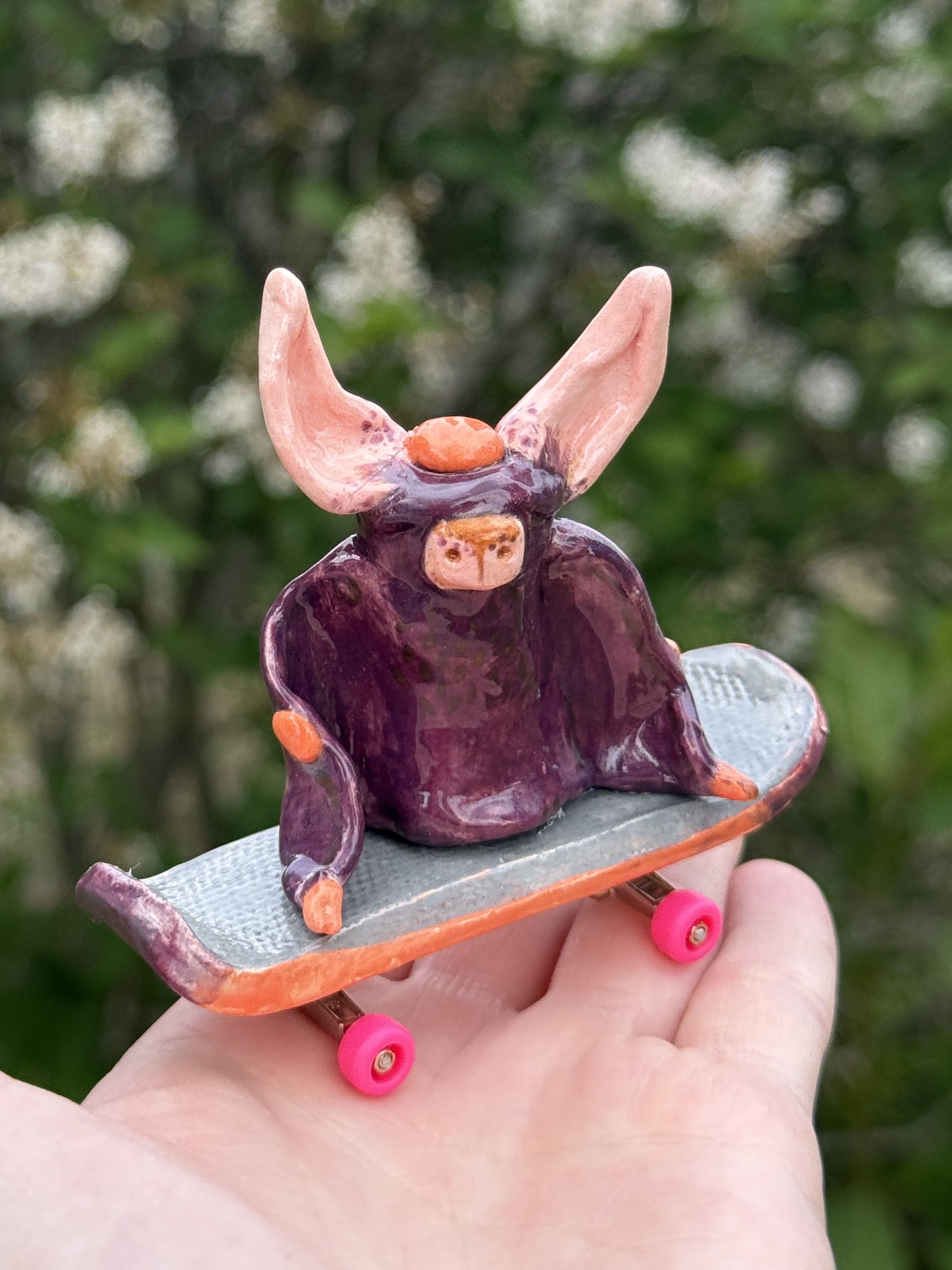 a bat on a skateboard