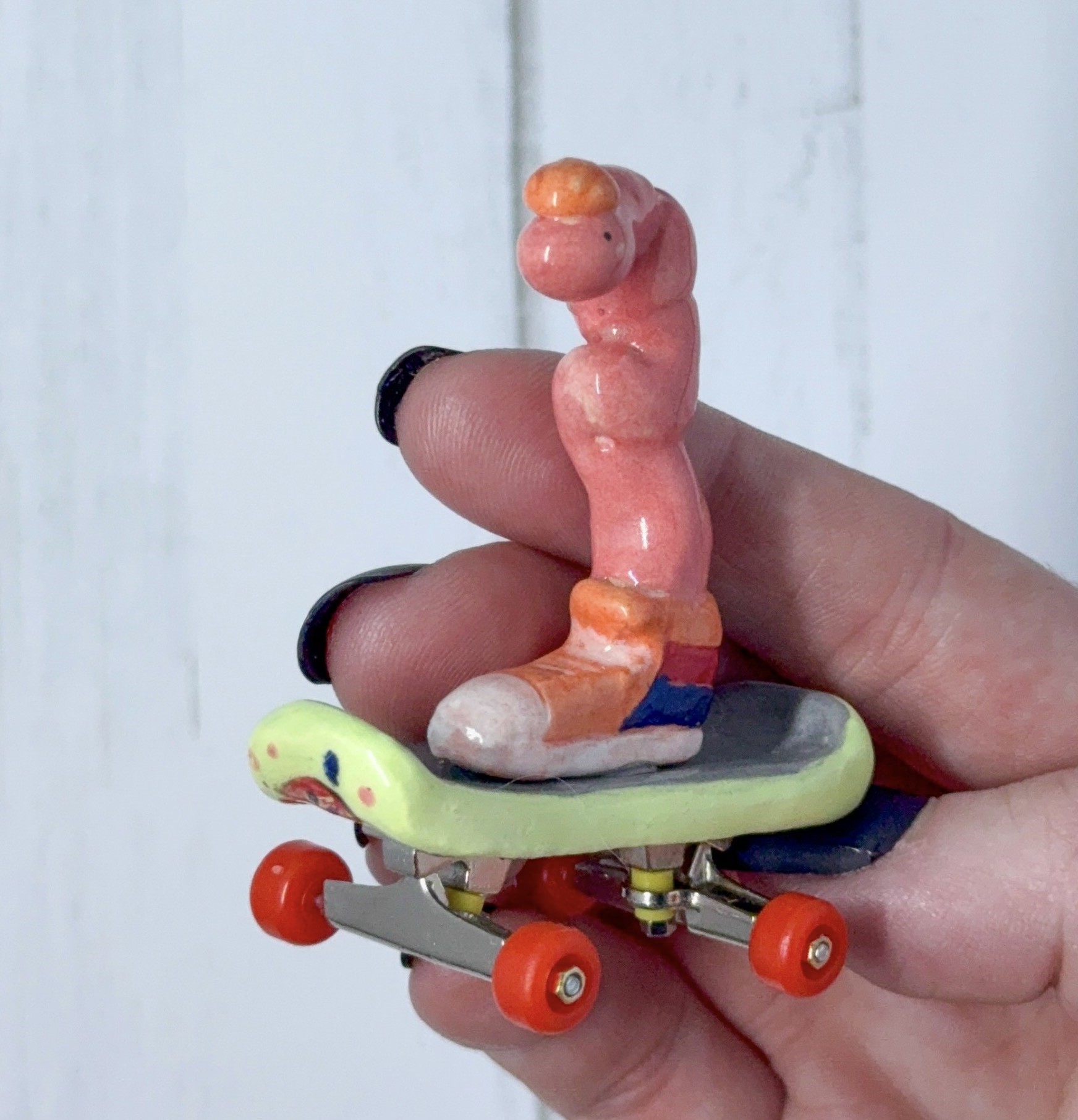 a snake in a sneaker on a skateboard